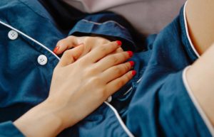 woman holding stomach ache