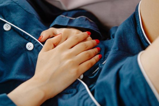 woman holding stomach ache