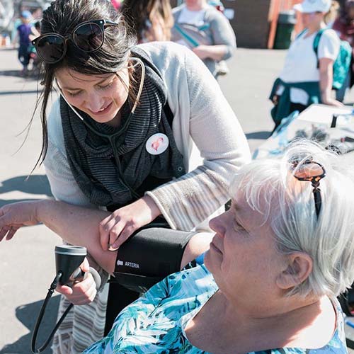 Jola Sikorski treating a patient outdoors