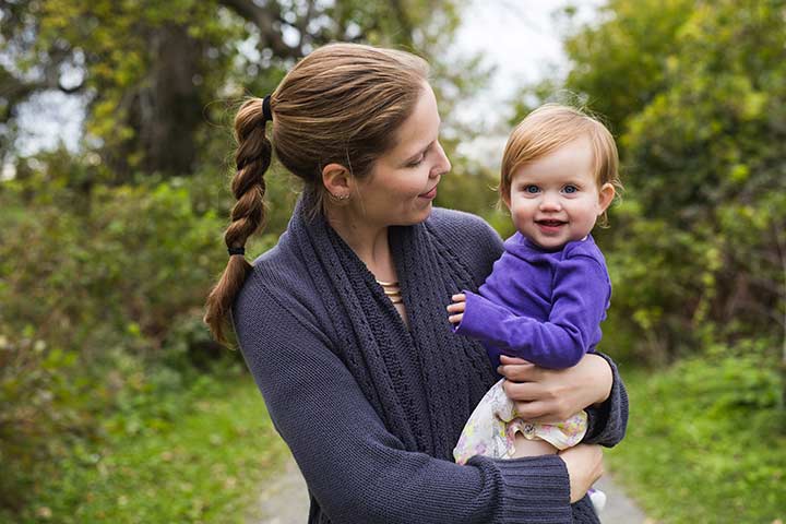 Woman holding a smiling toddler