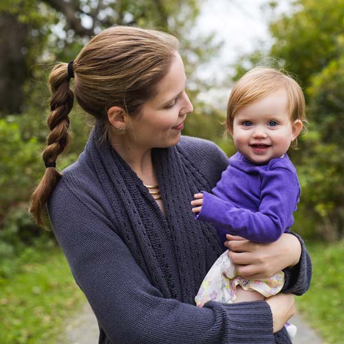 Dr Kealy Mann holding one of her children